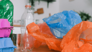 plastic bags and bottles on a table in a kitchen