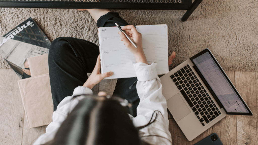 woman writing in her notebook