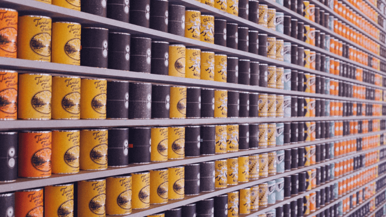 a variety of canned foods on shelves in a store