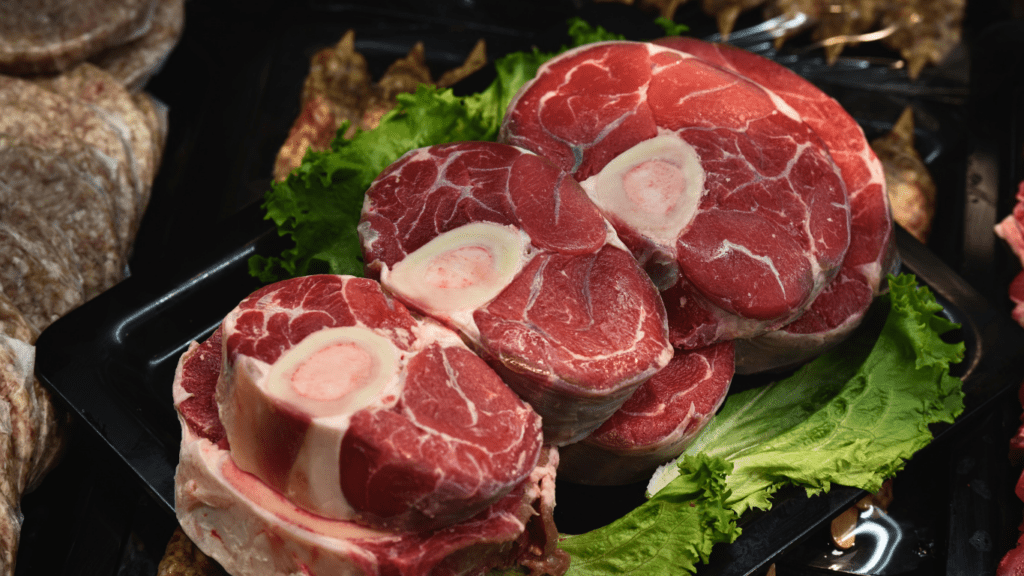 assorted cuts of meat on a cutting board