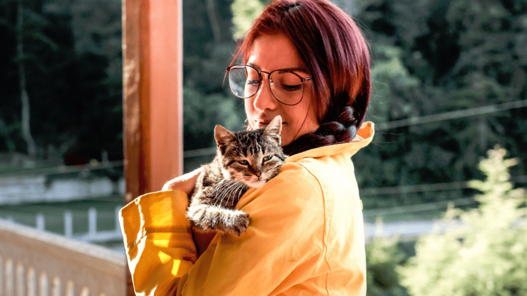 woman giving comfort to her cat